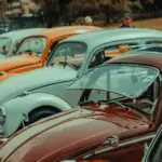 Classic cars lined up in a row at a collector car show