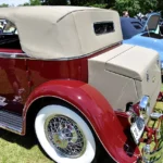 This Murphy Duesenberg's Provenance Is First-Rate. Its Engine Tells a More Complicated Story. Rear three-quarter view of a red Duesenberg Model J with Murphy convertible berline coachwork and tan top at a concours