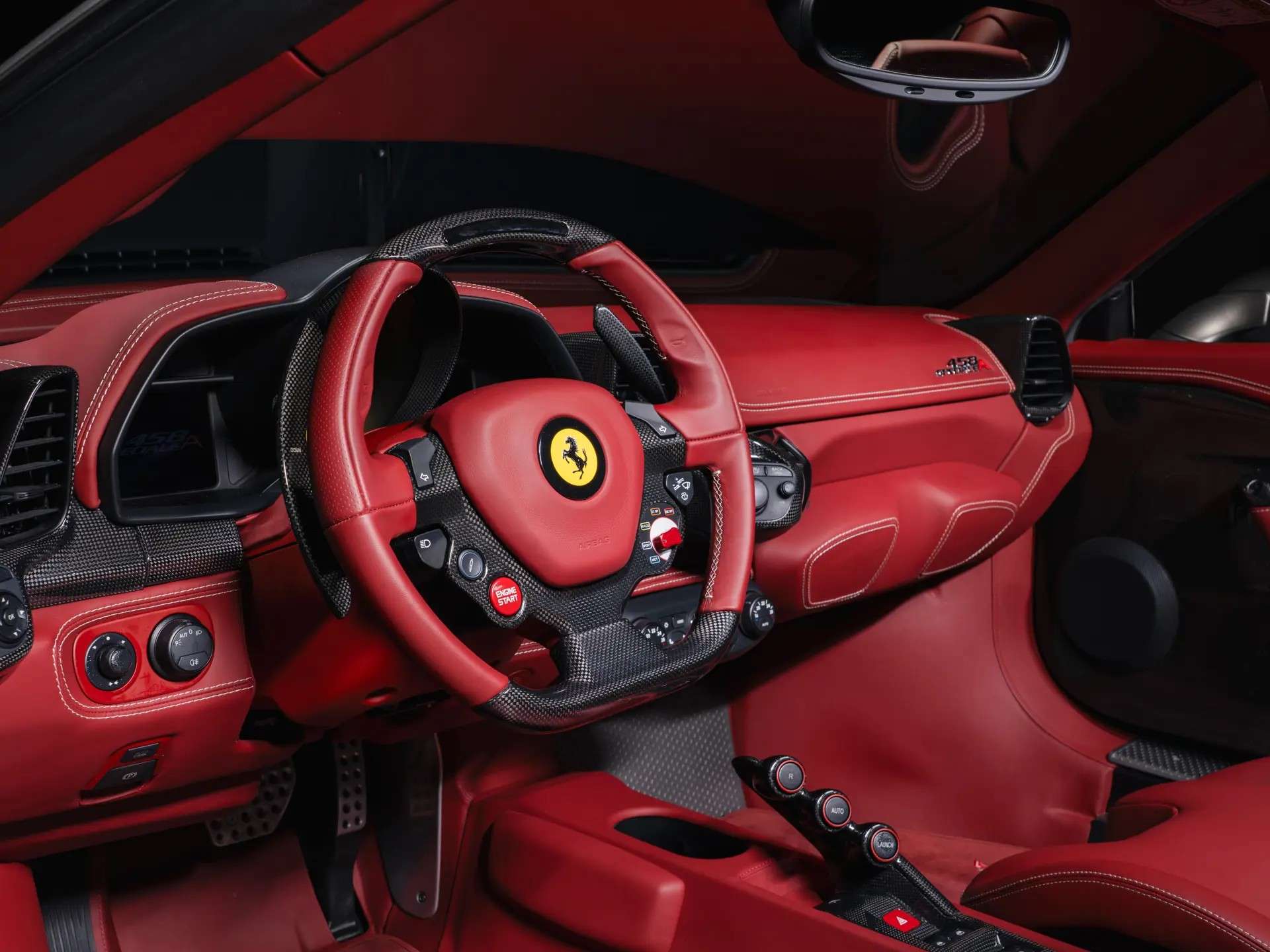 Bordeaux leather cockpit and carbon-fiber steering wheel of the auction 458 Speciale A