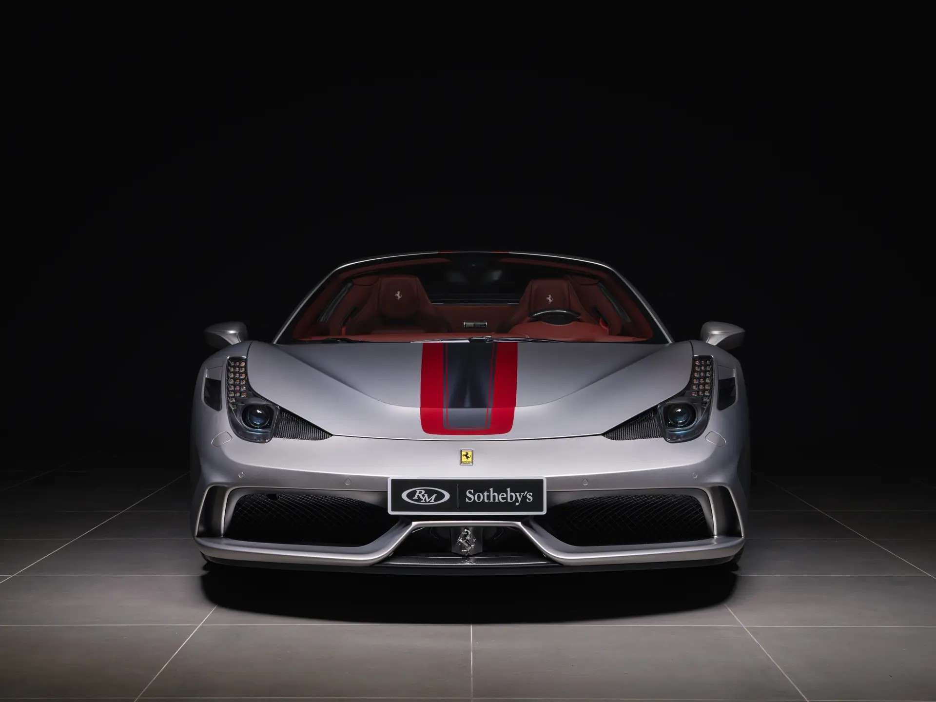 Head-on view of the 458 Speciale A showing its Rosso Fiorano and Grigio Silverstone center stripe