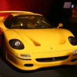 Yellow Ferrari F50 on display, the Giallo Modena color behind the record for Ferrari F50 value