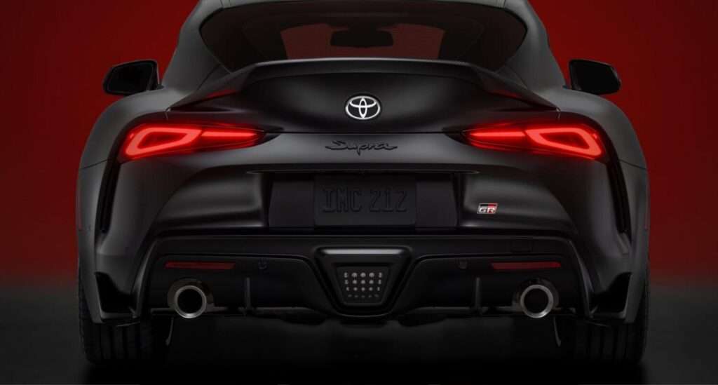 Rear view of the 2026 GR Supra MkV Final Edition showing its carbon fiber ducktail spoiler and dual exhaust