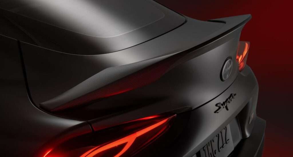 Close-up of the GR Supra MkV Final Edition's carbon fiber rear spoiler and taillight
