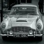 Classic Aston Martin DB-series front three-quarter view in black and white