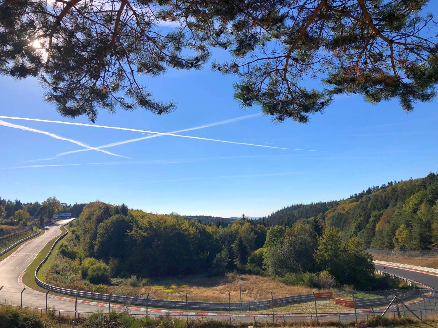 A banked corner on the Nürburgring Nordschleife circuit in Germany