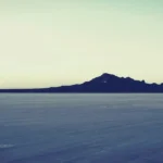 Today in Collector Car History: The 1932 Pierce-Arrow Twelve's Record Run at Bonneville a large body of water with mountains in the background