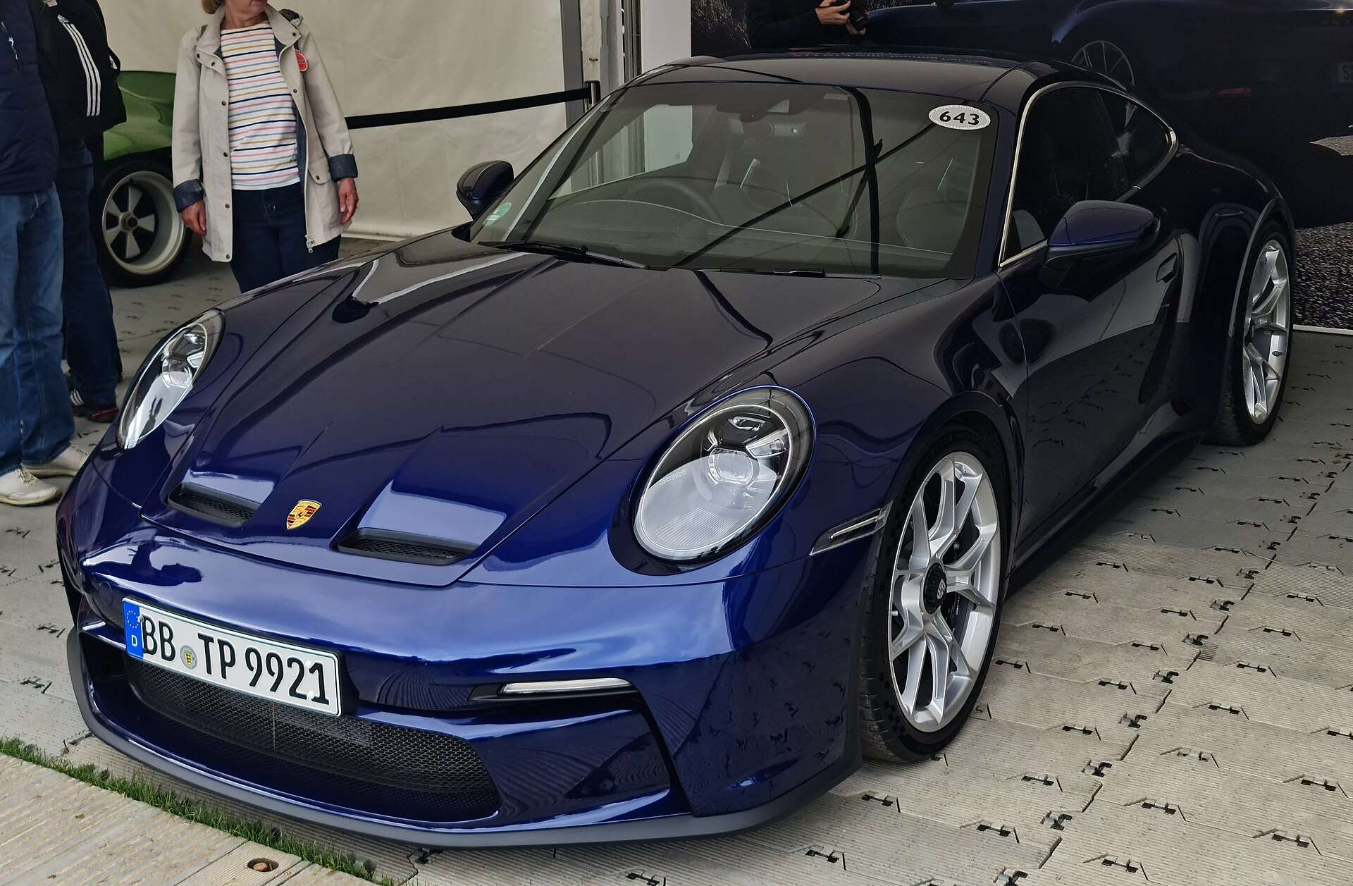 Blue Porsche 992-generation 911 GT3 with Touring package, front three-quarter view