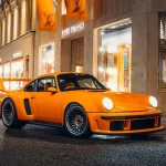 Solid Tangerine Porsche 911 Reimagined by Singer DLS Turbo, the Firefly Commission, photographed at night in London