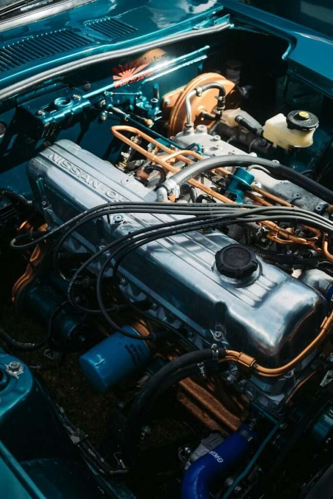 Datsun 240Z L24 inline-six engine bay with dual carburetors