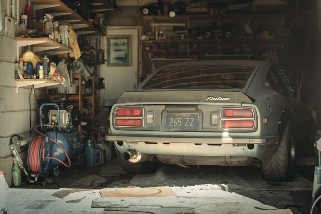 Datsun 240Z stored long-term in a garage, showing the kind of neglect that leads to rust
