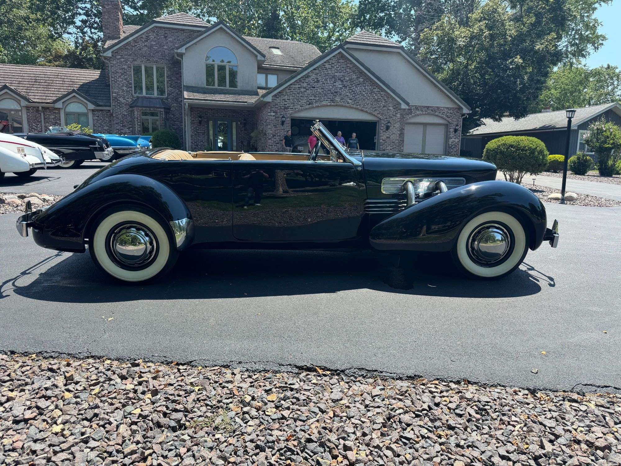 1937 Cord 812 Supercharged Phaeton parked in a driveway