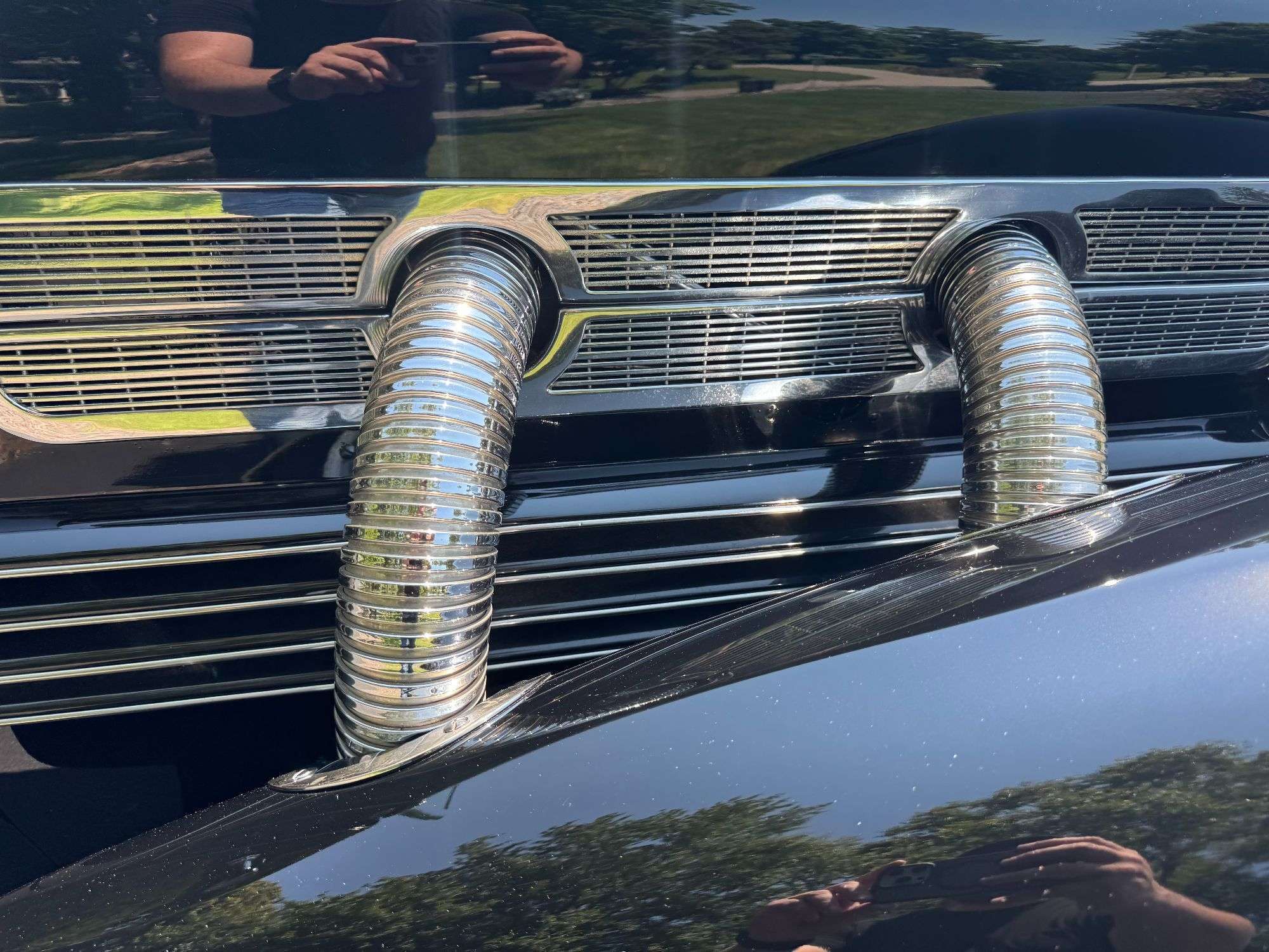Chrome external exhaust pipes on the supercharged 1937 Cord 812