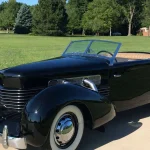 Front three-quarter view of the 1937 Cord 812 Supercharged Phaeton for sale at Aumann Auctions
