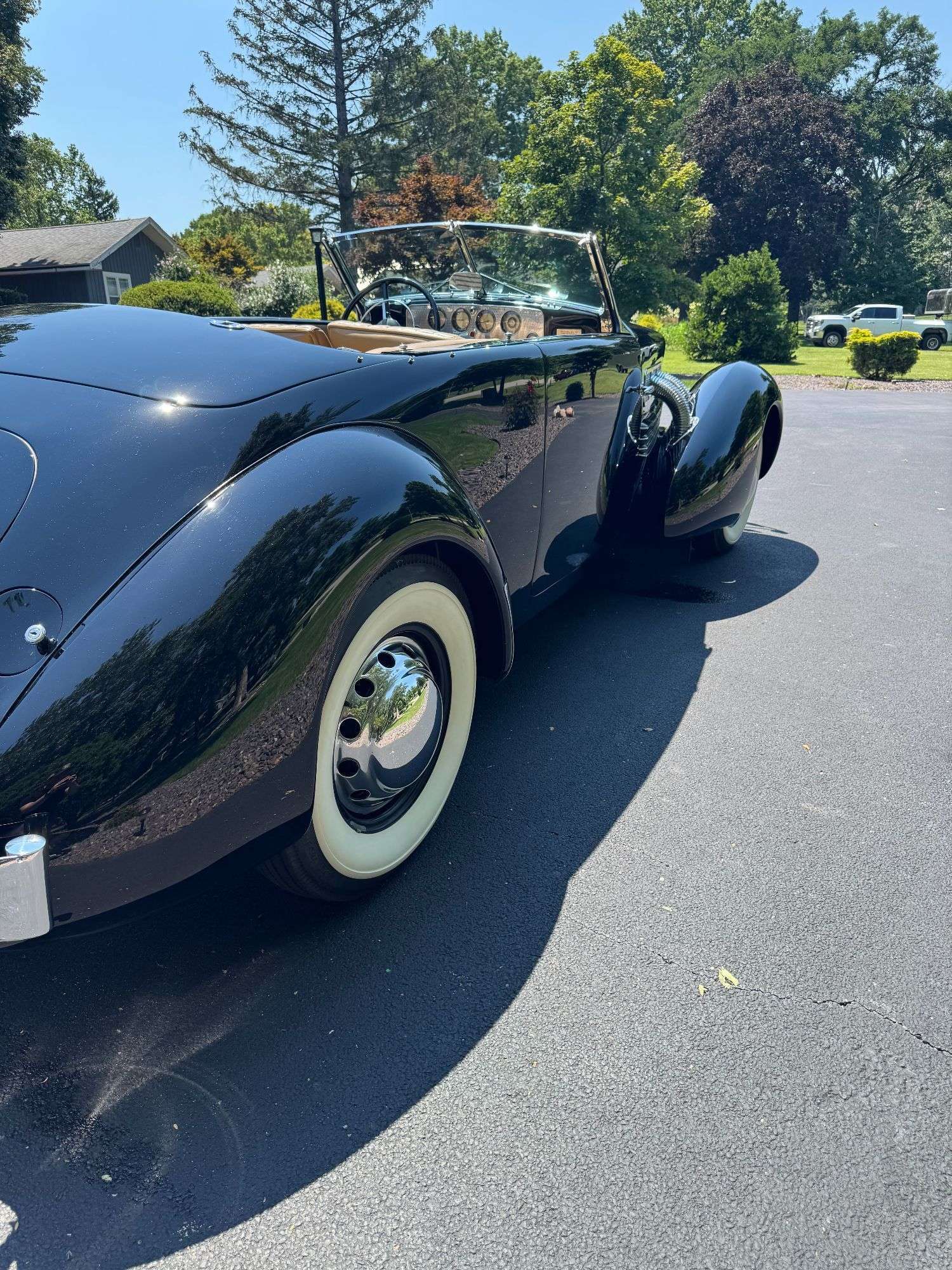 Rear three-quarter view showing the low stance of the 1937 Cord 812 Phaeton