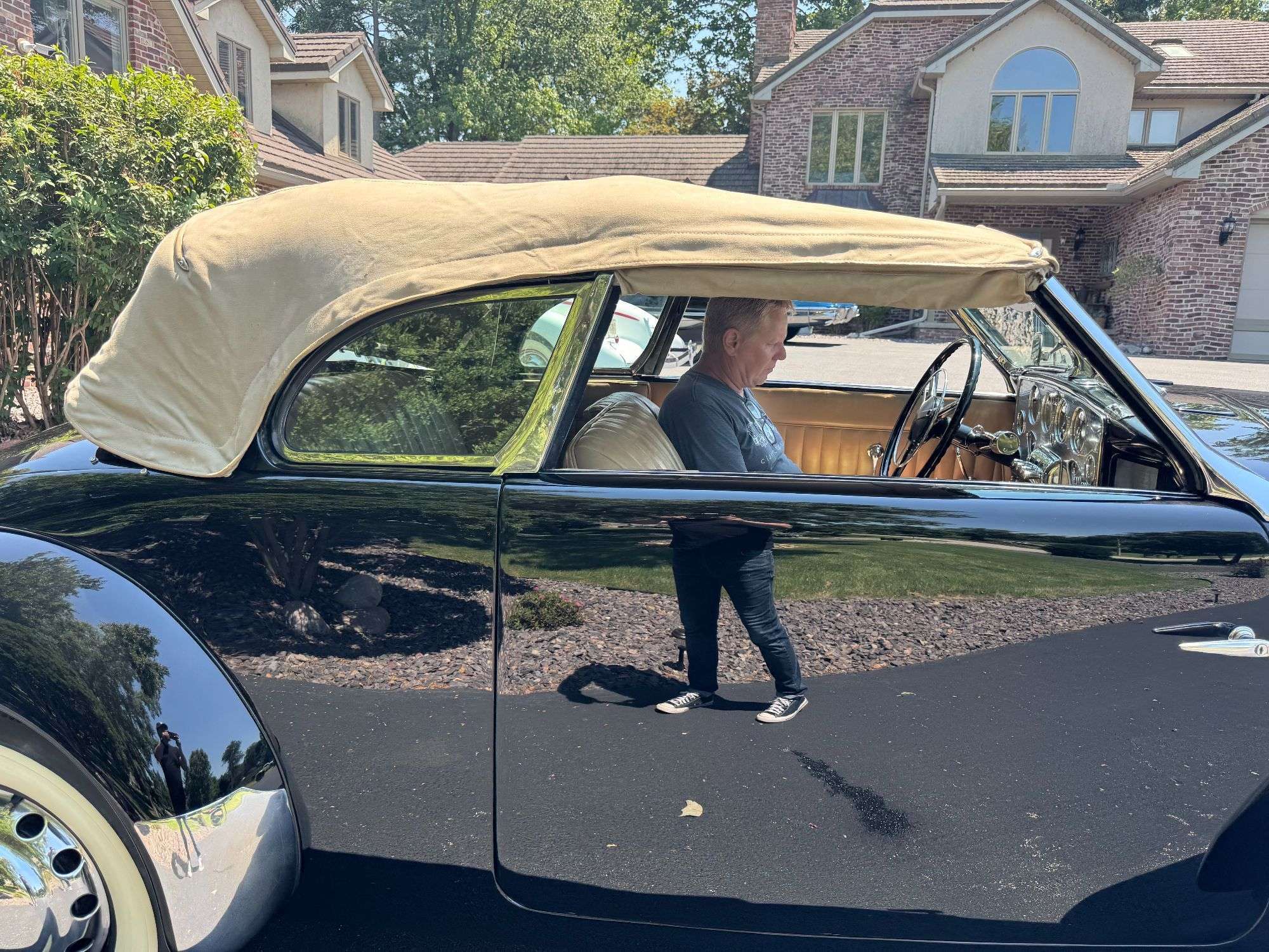 1937 Cord 812 Supercharged Phaeton with its tan convertible top raised