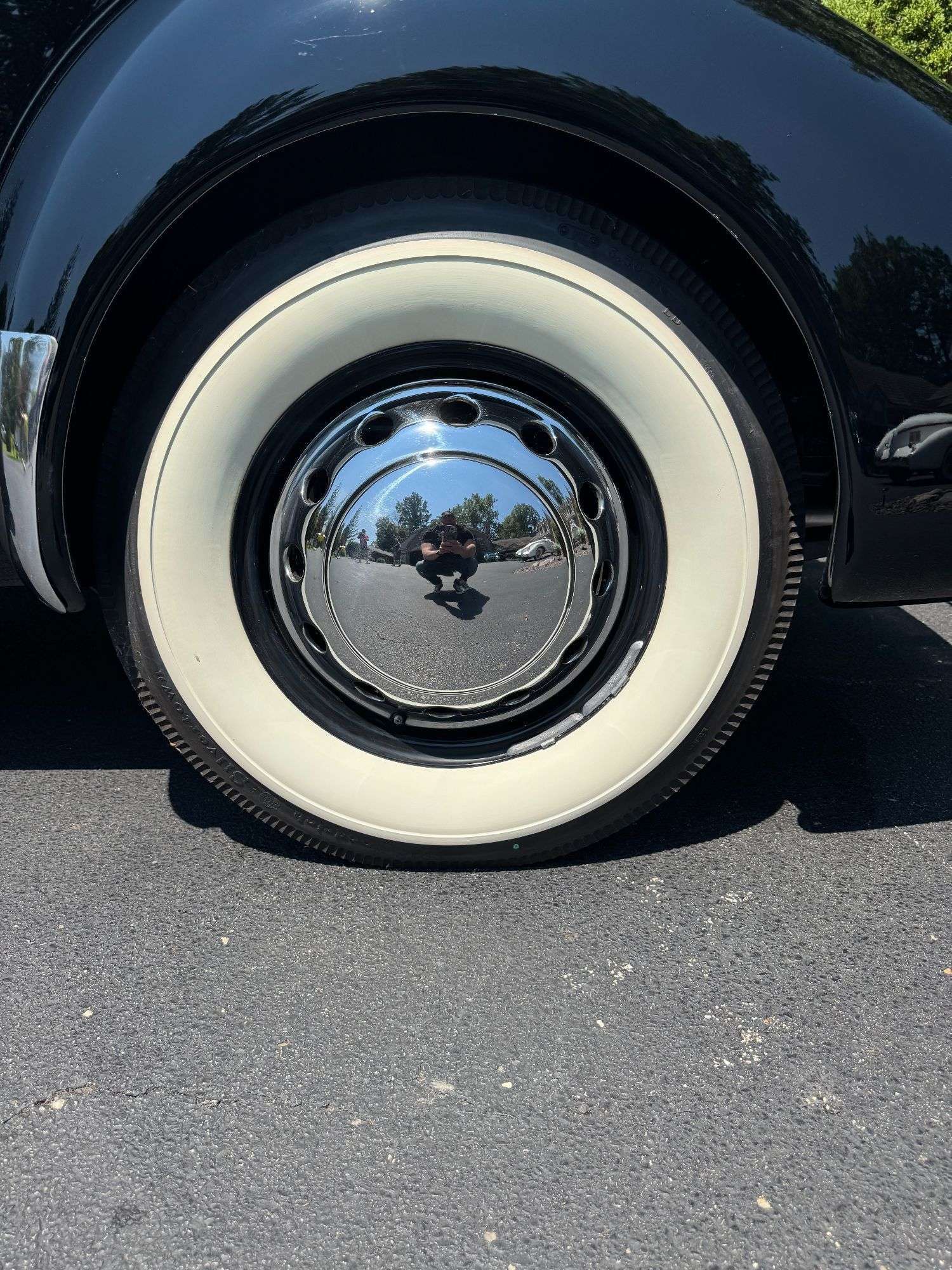 Whitewall tire and chrome hubcap on the 1937 Cord 812 Supercharged Phaeton
