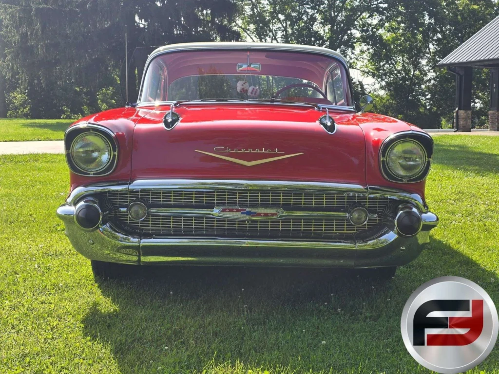 Front view of the 1957 Chevrolet Bel Air showing its chrome grille, bumper and gold hood V