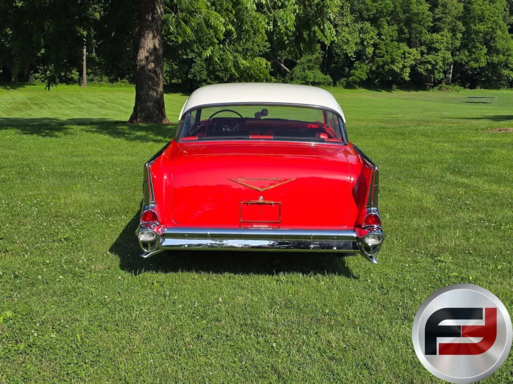 Rear view of the red 1957 Chevrolet Bel Air with white top