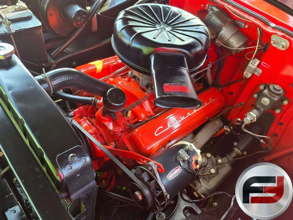 Orange 283 cubic-inch small-block V8 in the engine bay of the 1957 Chevrolet Bel Air
