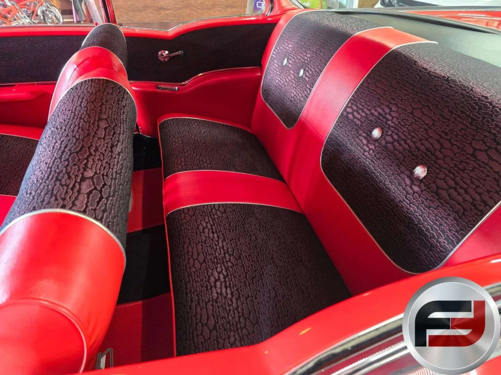 Red and black interior and bench seats of the 1957 Chevrolet Bel Air