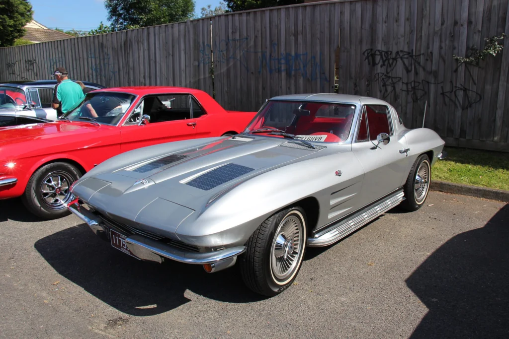 Silver 1963 Chevrolet Corvette Sting Ray split-window coupe with knock-off style wheels
