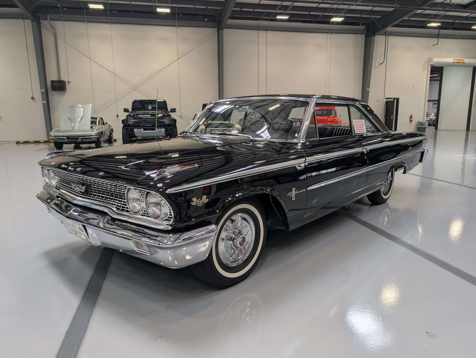 Front quarter of the 1963 Ford Galaxie in black with whitewall tires at GAA Classic Cars