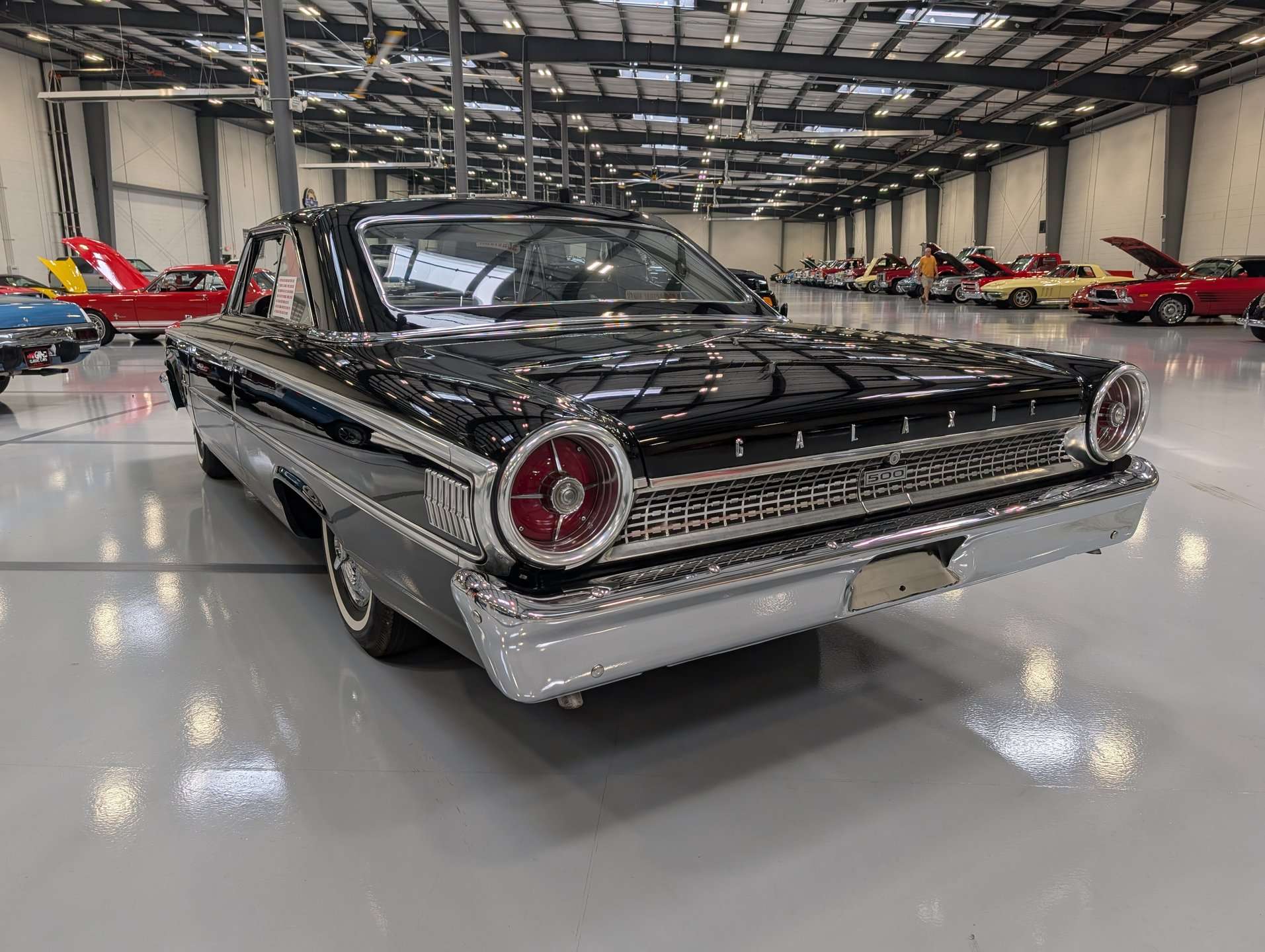 Rear view of the black 1963 Ford Galaxie with round taillights and chrome bumper