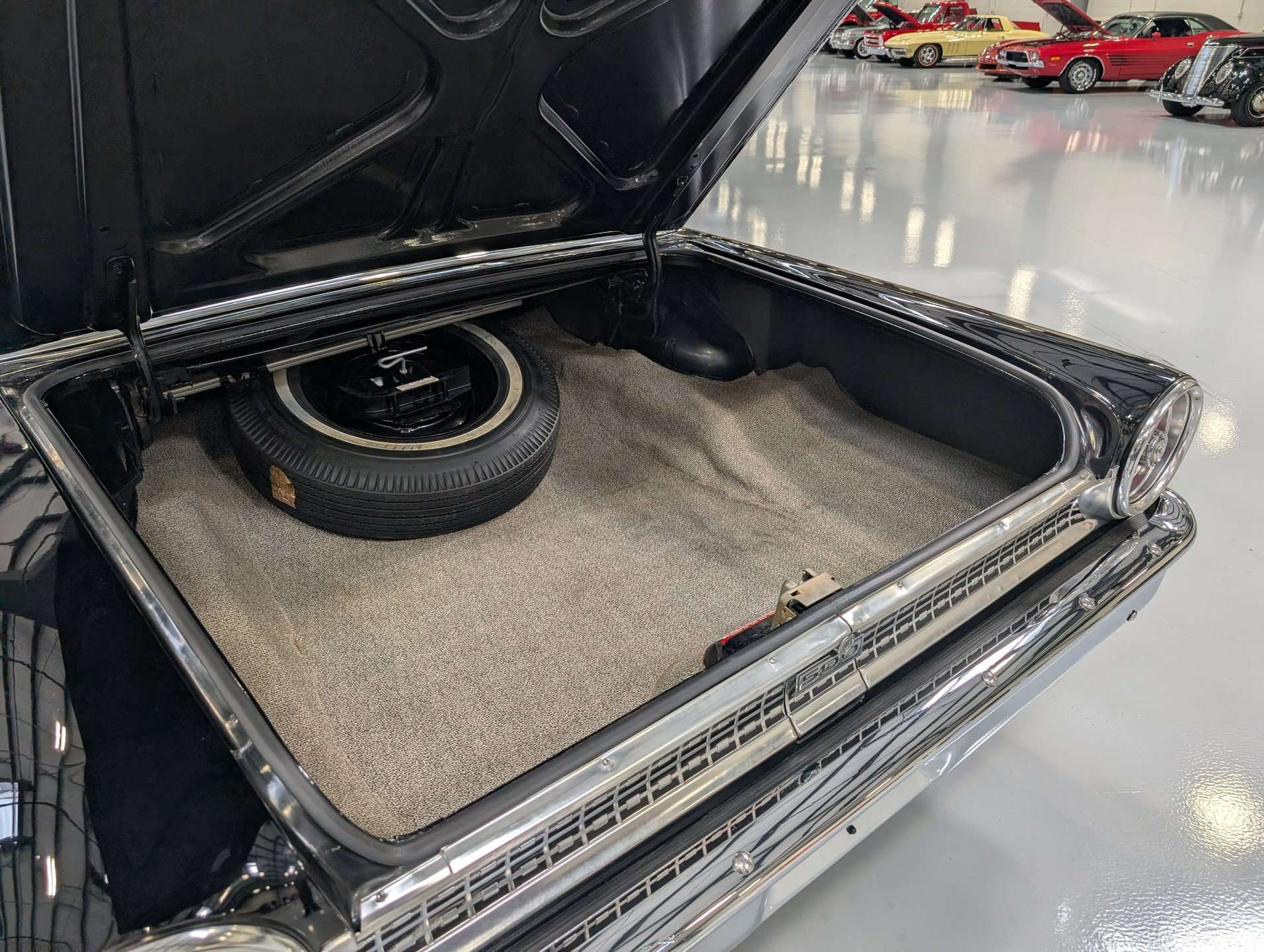 Trunk of the 1963 Ford Galaxie with spare tire and mat