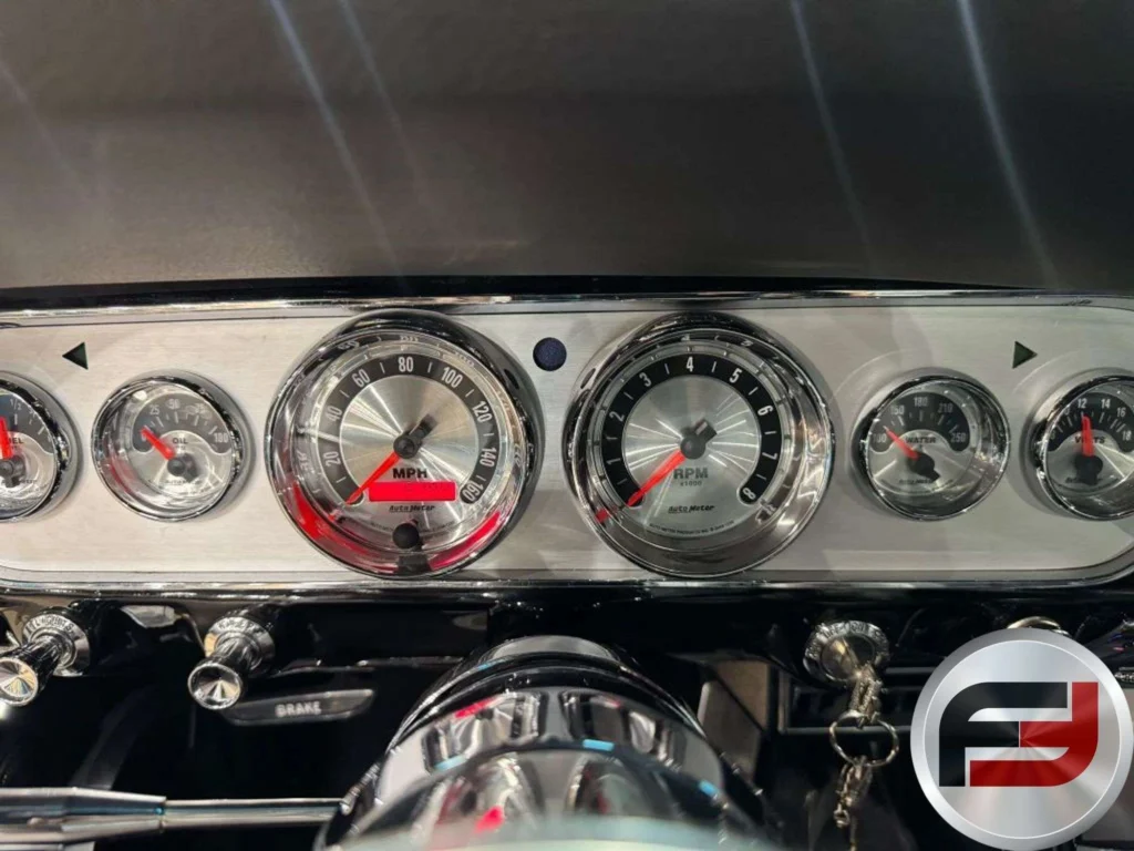 Aftermarket gauges in the dash of the 1965 Mustang Eleanor tribute fastback