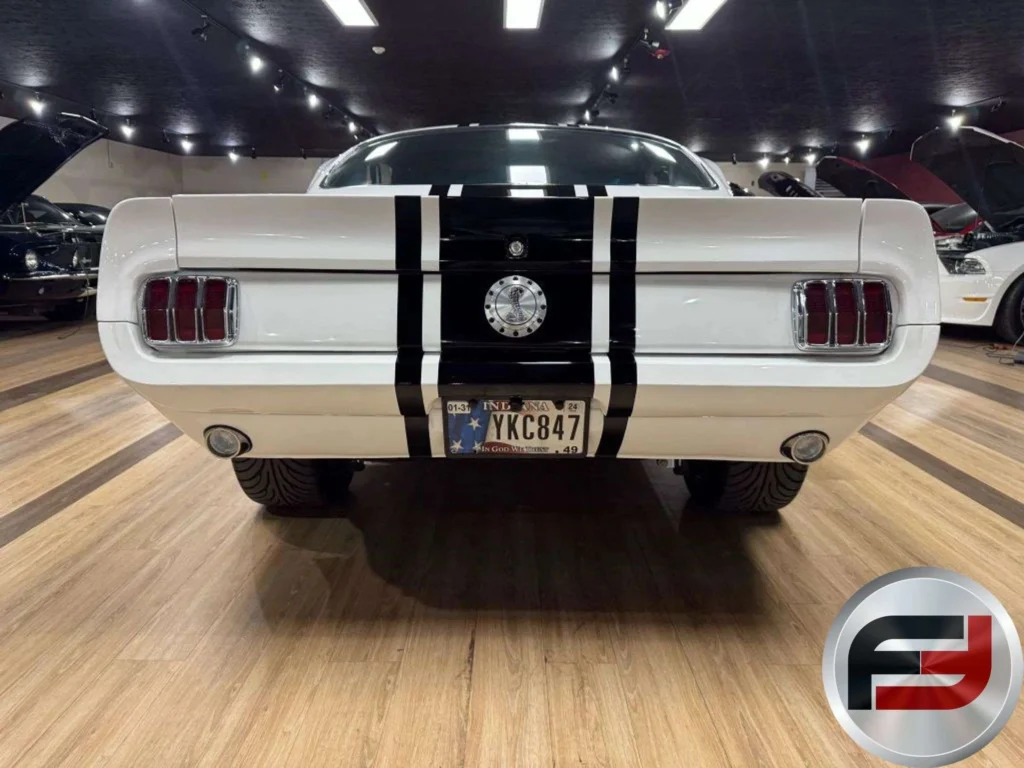 Rear view of the 1965 Mustang Eleanor tribute fastback showing painted black center stripes