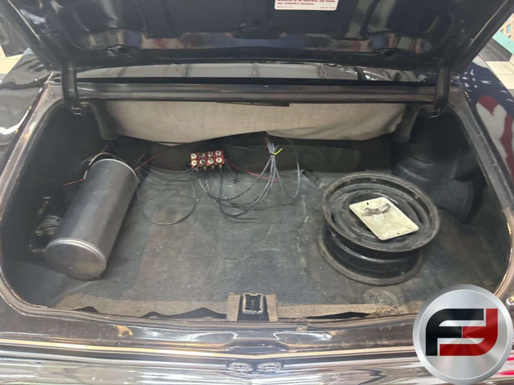Air ride suspension tanks mounted in the trunk