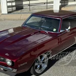 1969 Chevrolet Camaro Z/28 custom coupe in Candy Apple Red, front three-quarter view