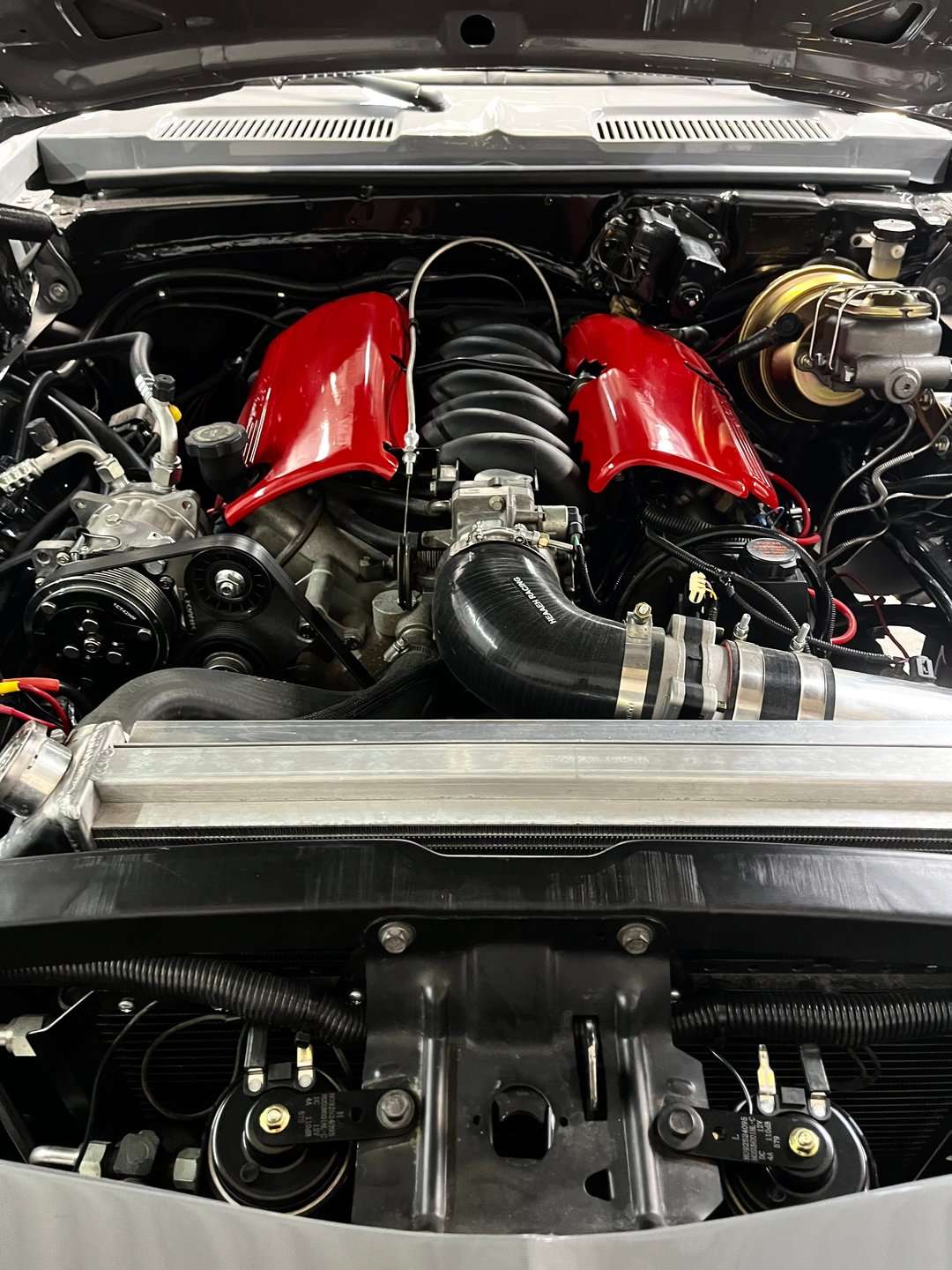 All-aluminum LS engine with red intake covers in the 1969 Chevrolet Camaro
