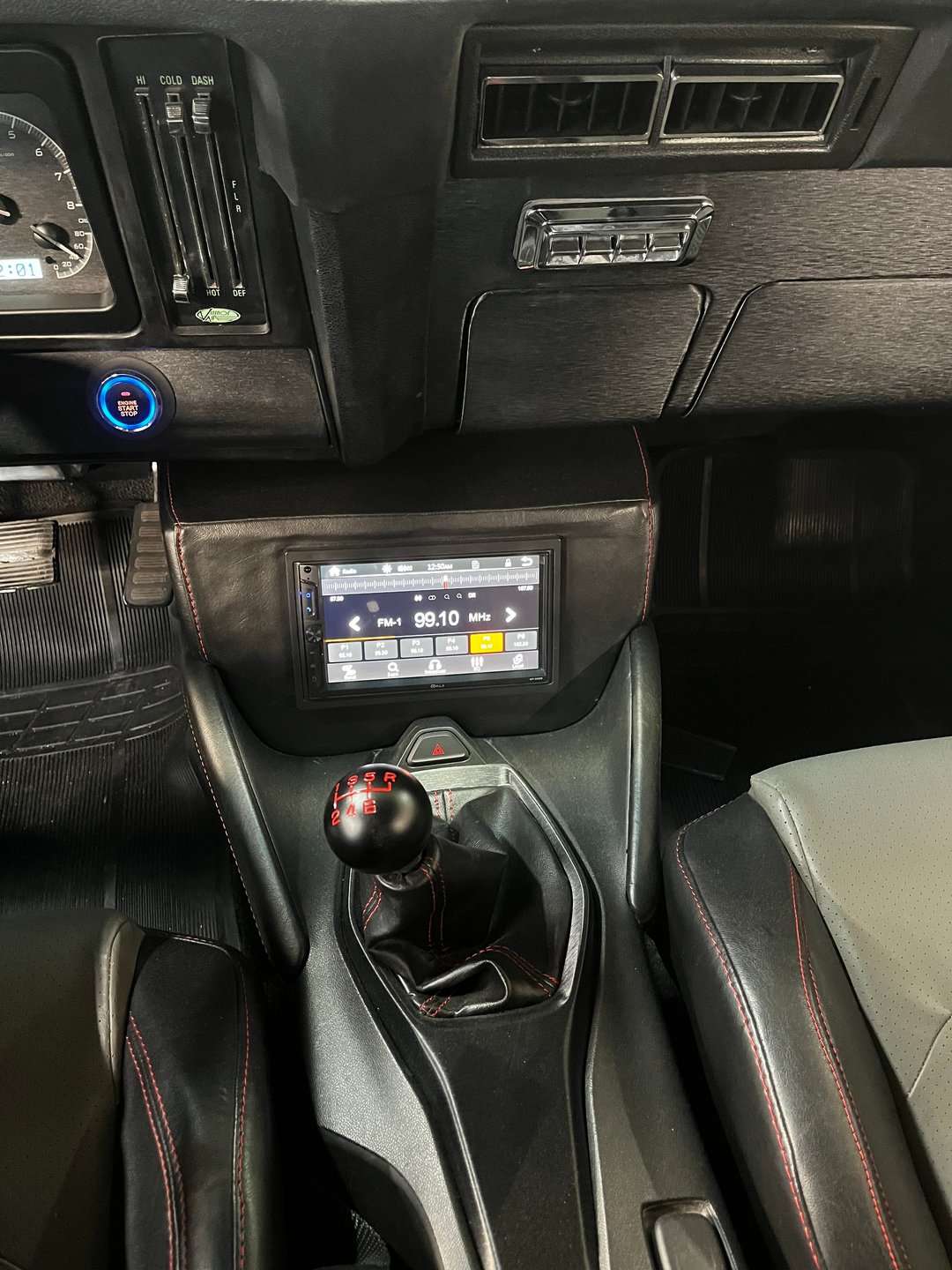 Six-speed shifter and big screen display in the 1969 Camaro console