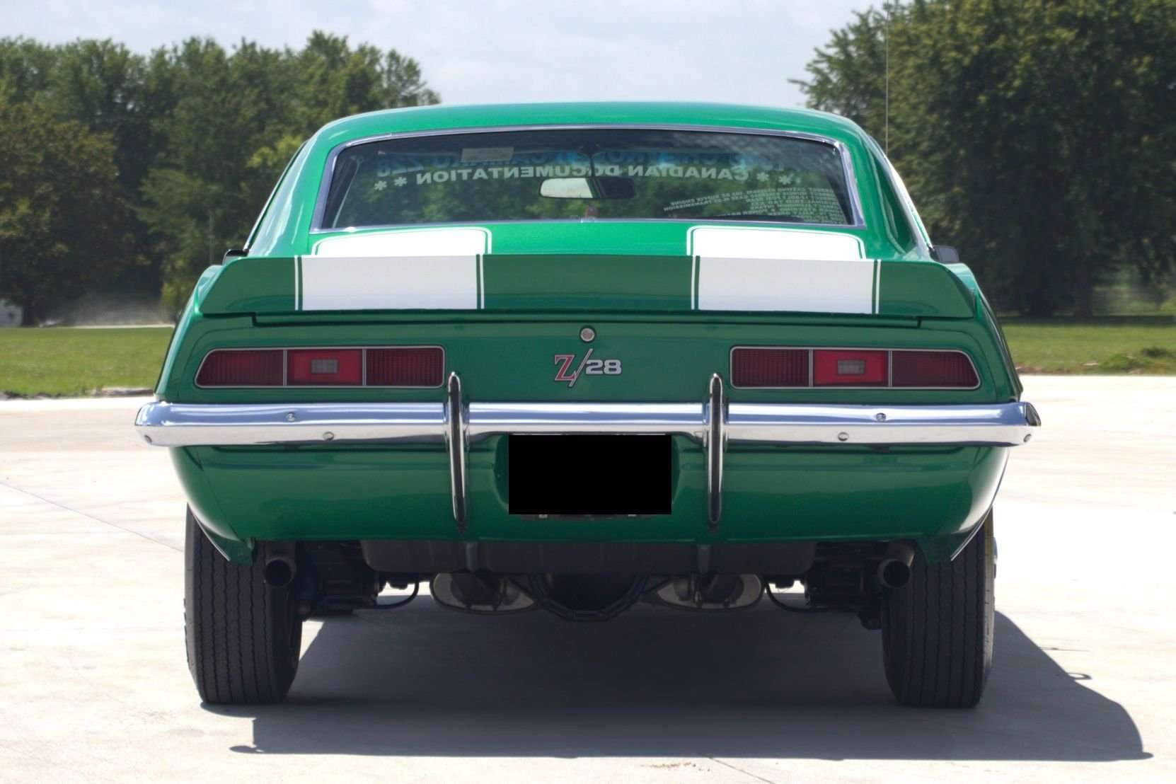 Rear view of the 1969 Camaro Z/28 with white stripes and Z/28 badge