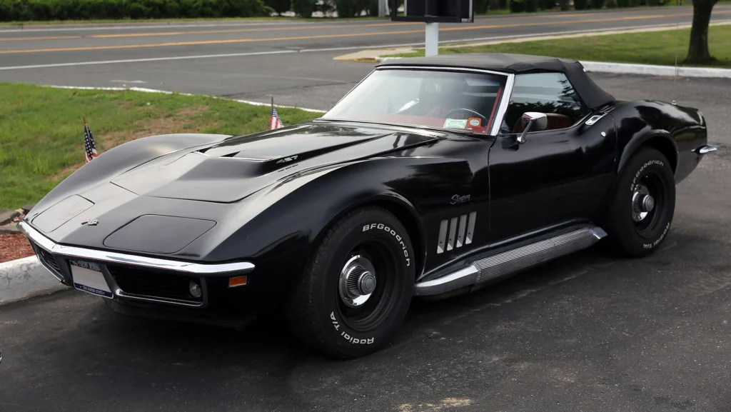 Black 1969 Chevrolet Corvette Stingray convertible with the top down in a three-quarter view