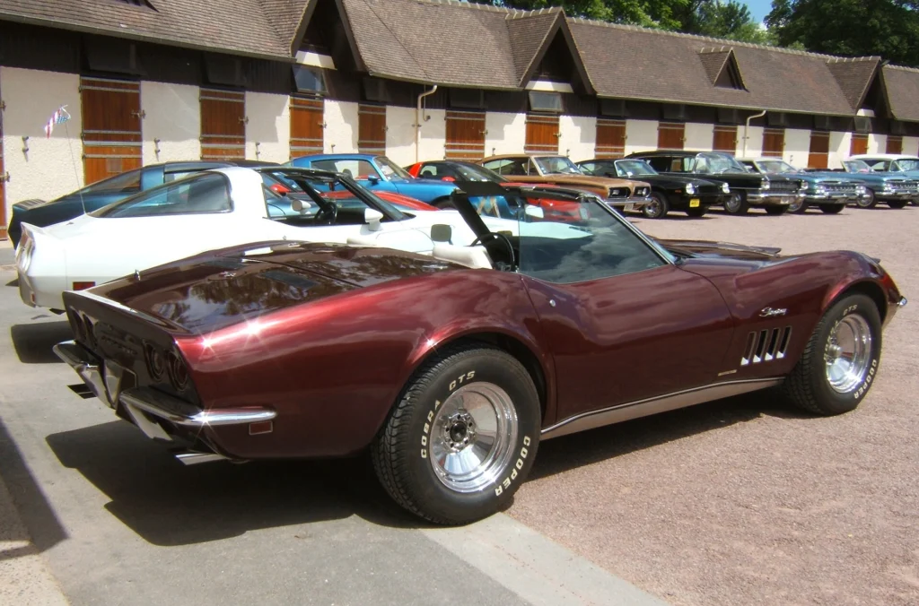 Maroon C3 Chevrolet Corvette Stingray convertible parked with its top down