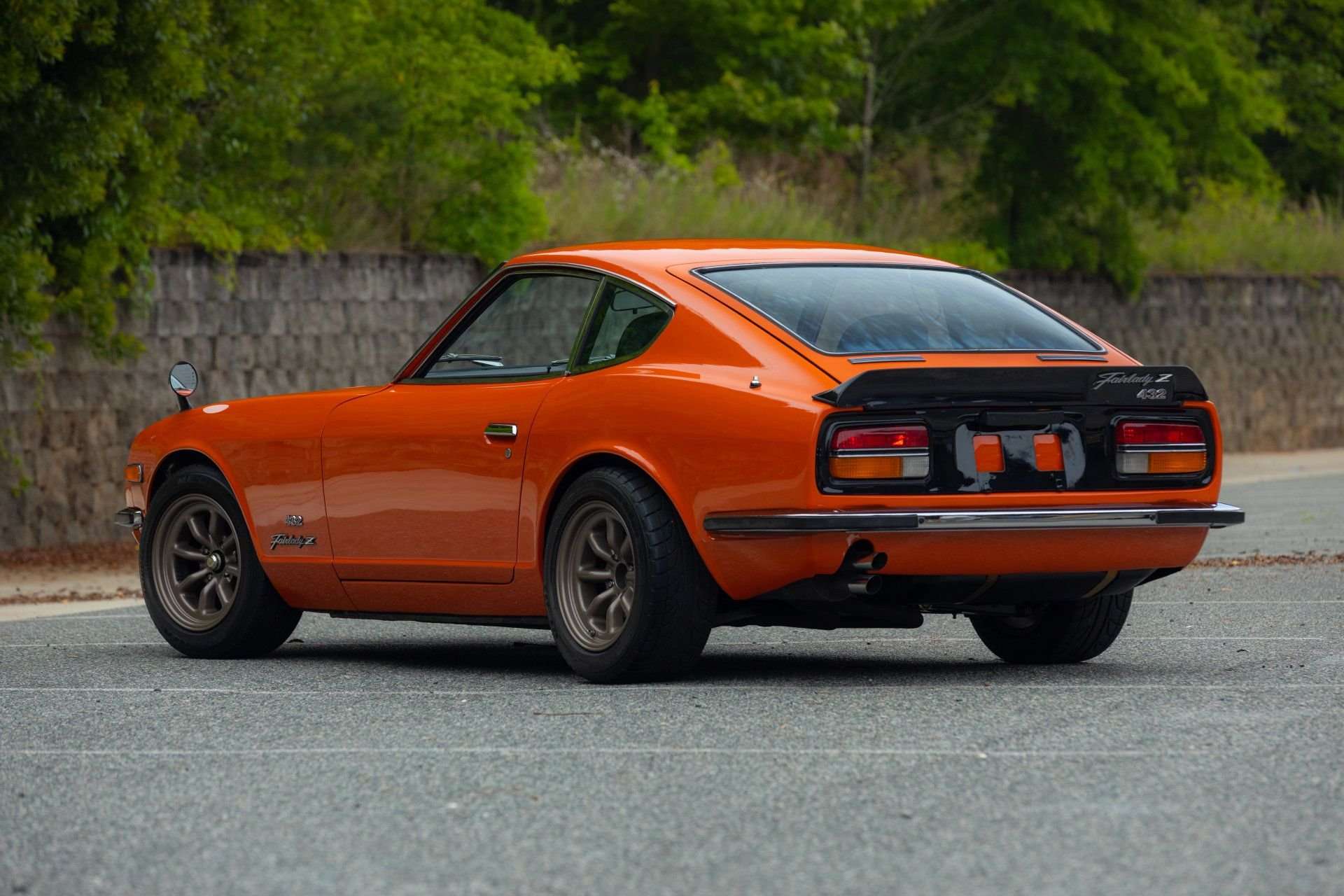 Rear three-quarter view of the 1969 Datsun Fairlady Z432 with rear spoiler