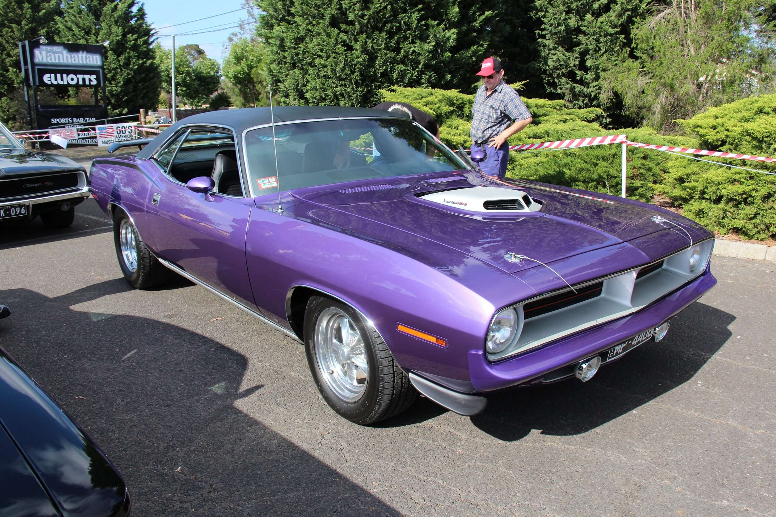 A 1970 Plymouth Cuda with factory 440 Six Pack, shown for reference against the custom Hemi Cuda sold at Fall Carlisle 2026
