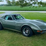 Original-Paint 1972 Chevrolet Corvette Convertible for Sale at Freije's Fall Big Boy Toy Auction Steel Cities Gray 1972 Chevrolet Corvette convertible with hardtop, front three-quarter view on grass