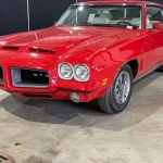 1972 Pontiac GTO with 455 HO Power and a Four-Speed Heads to Freije & Freije Auctioneers Cardinal Red 1972 Pontiac GTO front three-quarter view at Freije & Freije Auctioneers
