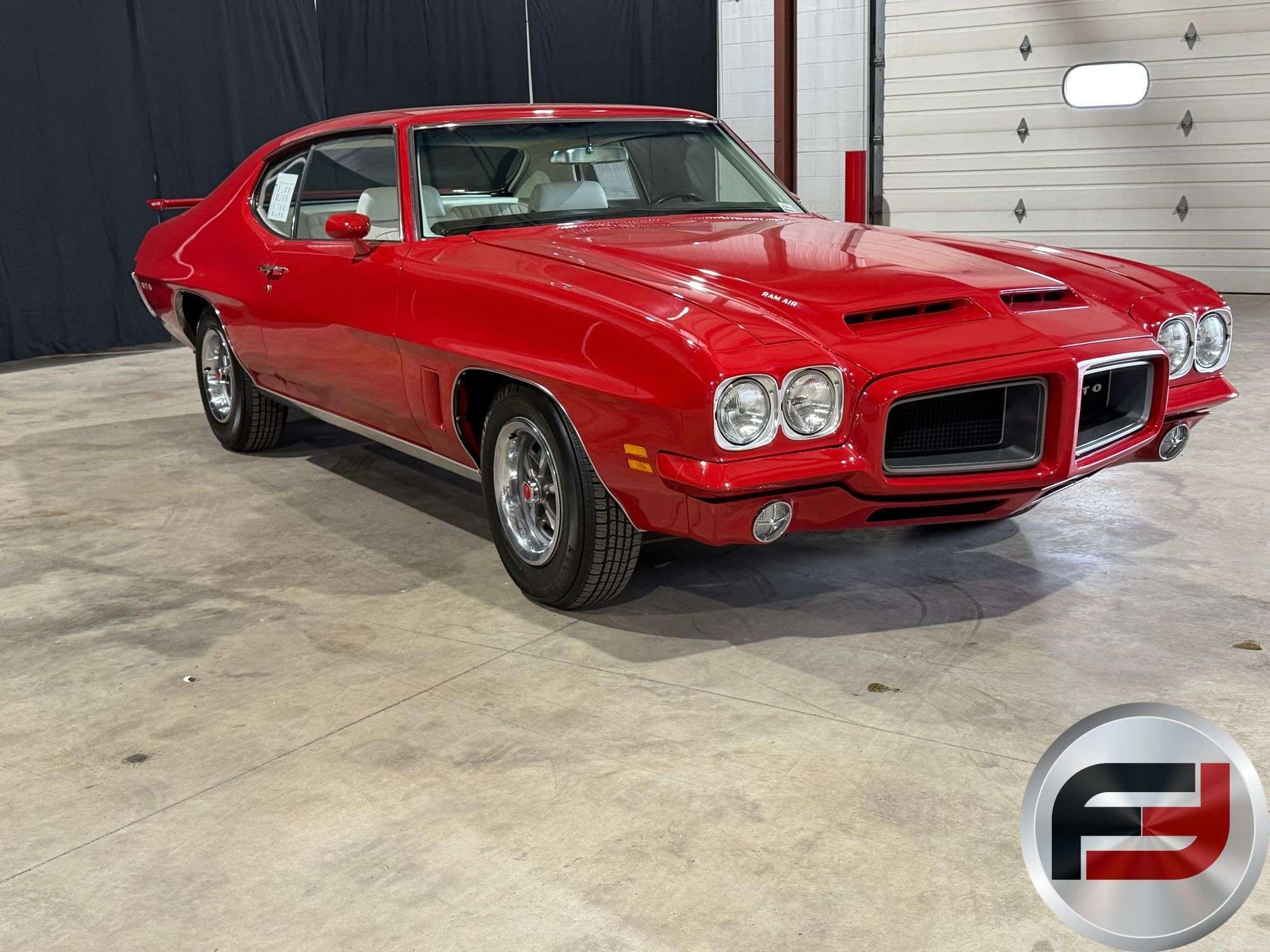 1972 Pontiac GTO with Ram Air hood and Cardinal Red paint offered by Freije & Freije Auctioneers