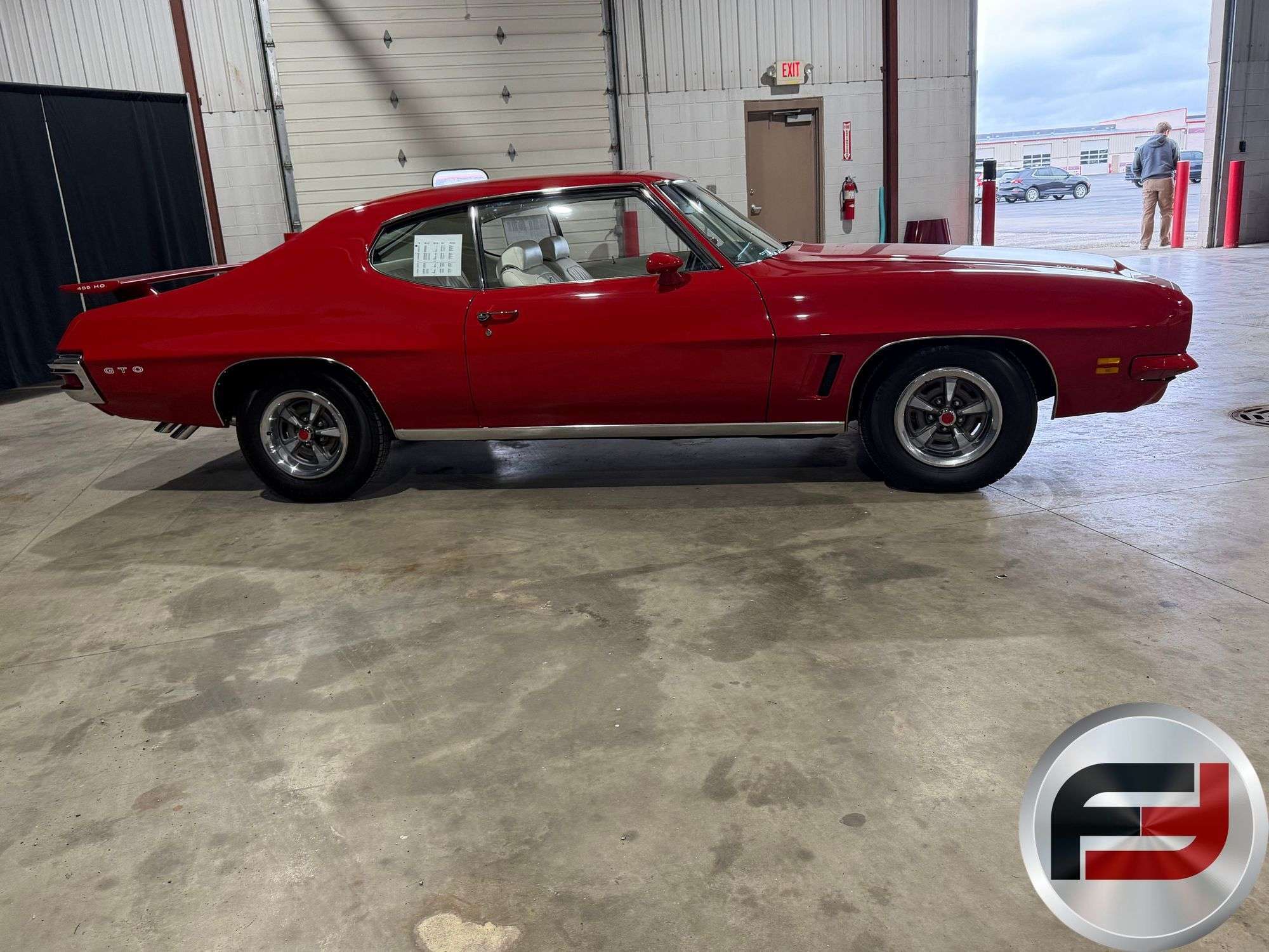 Side profile of the 1972 Pontiac GTO in Cardinal Red