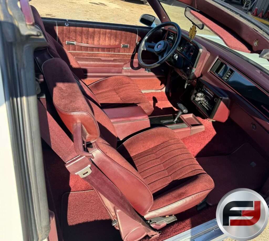 Maroon bucket seats and center console in the 1987 Monte Carlo SS Aerocoupe
