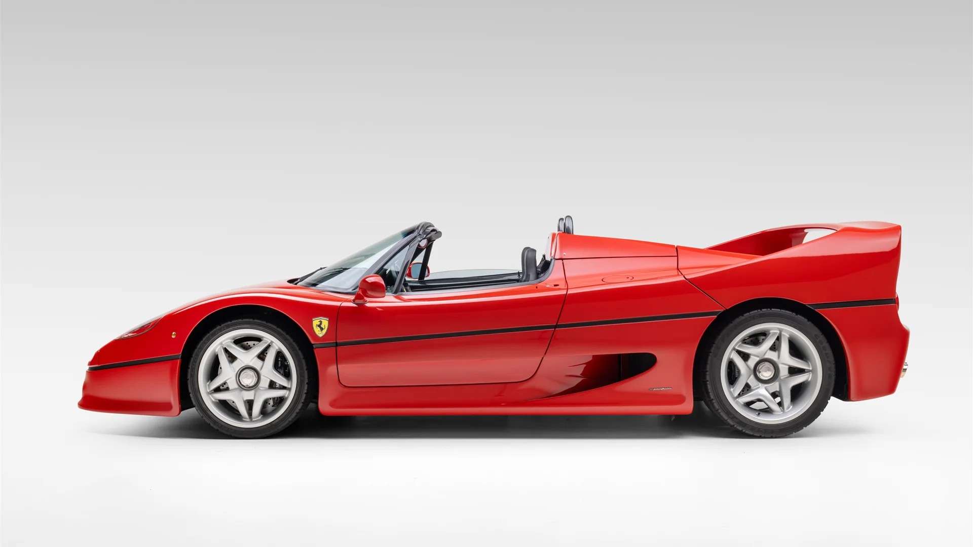 Side profile of the 106-mile 1997 Ferrari F50 configured as a barchetta