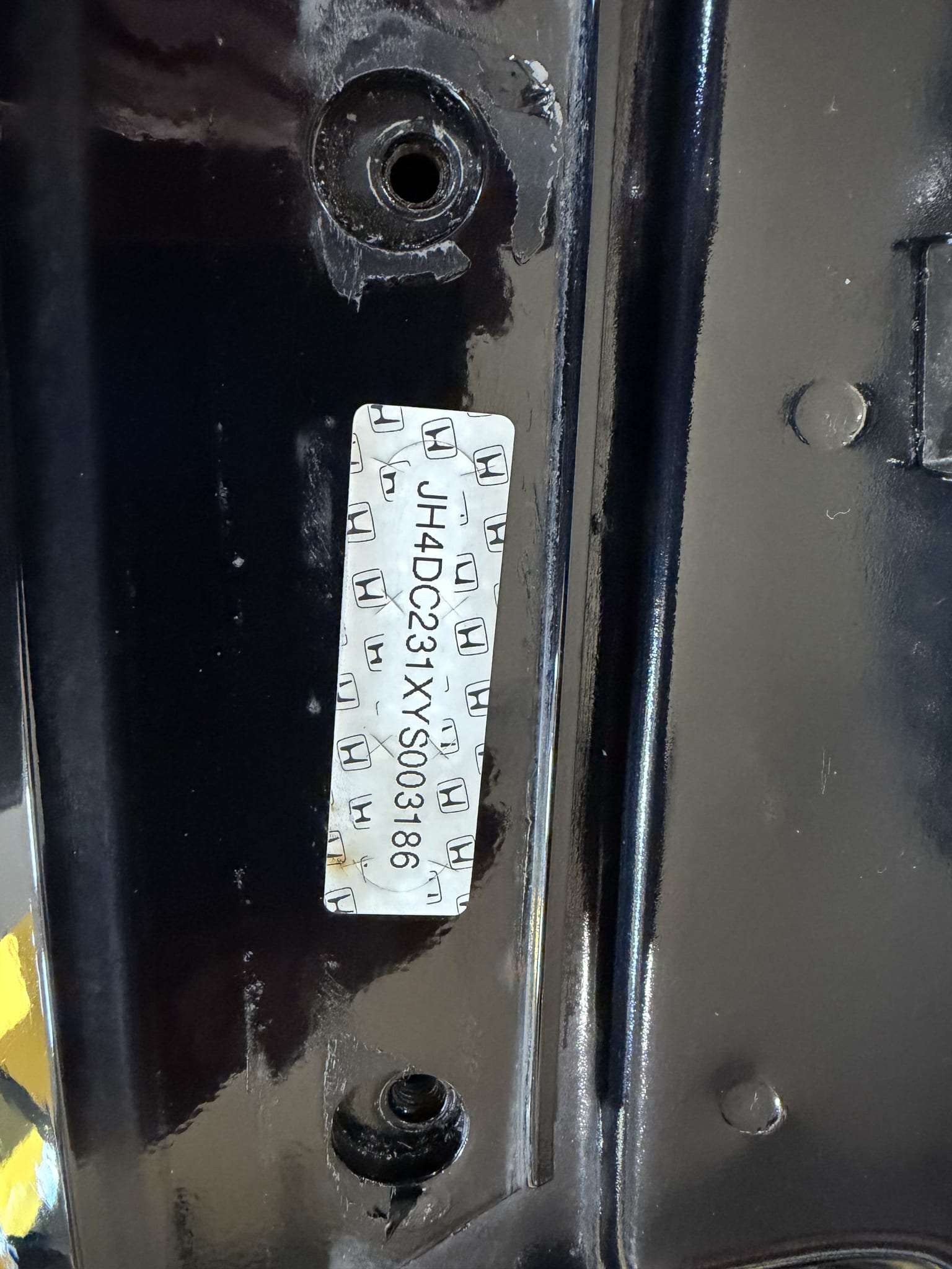 Factory VIN sticker on a body panel of a 2000 Acura Integra Type R