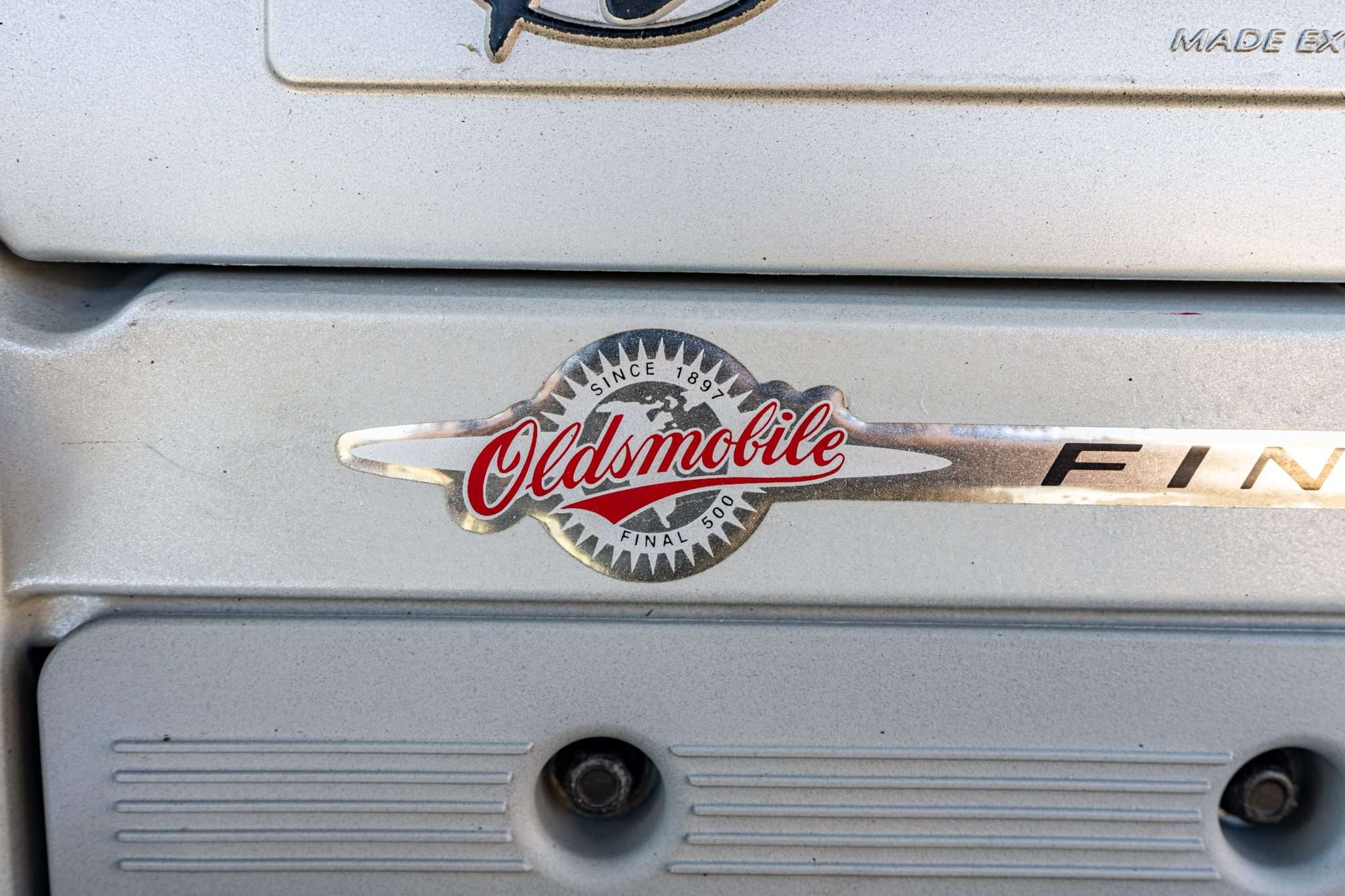 Oldsmobile Final 500 badge on the cam cover of the 4.0-liter L47 V8 in a 2003 Aurora
