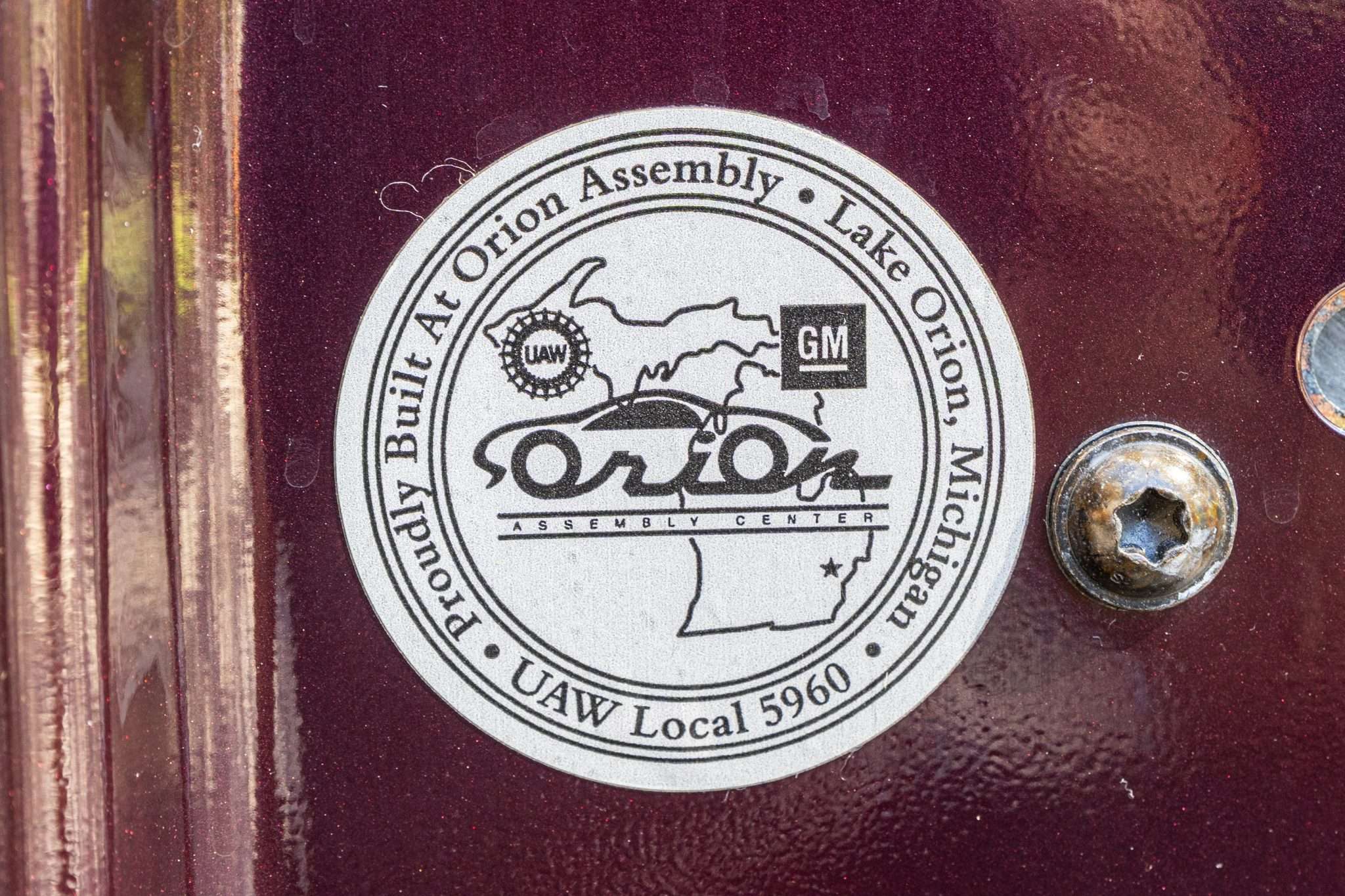 Orion Assembly Lake Orion Michigan UAW Local 5960 medallion on the door jamb of a 2003 Oldsmobile Aurora