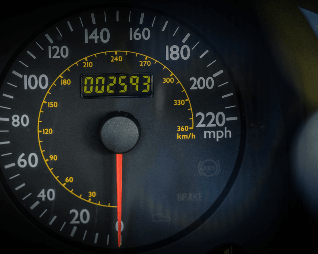 Instrument cluster showing the low mileage on the 2006 Ferrari F430 Spider