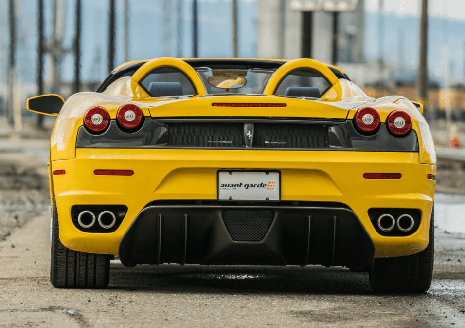 Rear view of the yellow Ferrari F430 Spider showing its quad exhaust tips